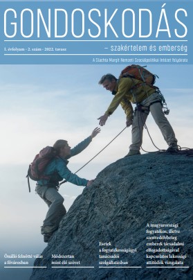 A képen a Gondoskodás újság borítója látható. A képen egy hegyen jobbra álló férfi kezét nyújtja a balra felmászó férfinak.